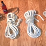 Ultimately I wound up with several serviceable lines.  Because I tied knots in the unwhipped ends, fraying was kept to a minimum.  I couldn't really whip them as dirty as they were, but some tye wraps would have been a better idea.