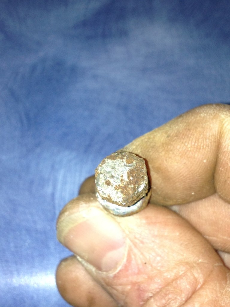 Here's the corroded bolt. It started out as 10mm but worked its way down into the SAE range.