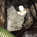 Aluminum tank has been leaking diesel into the sump for some time.