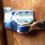 The latches were getting pretty crufty after 25 years.  A shot of WD-40 restored most of them to operation but the peeling chrome wasn't very attractive, and they appear to be zinc castings, not bronze or brass, so stripping them wasn't an attractive option.